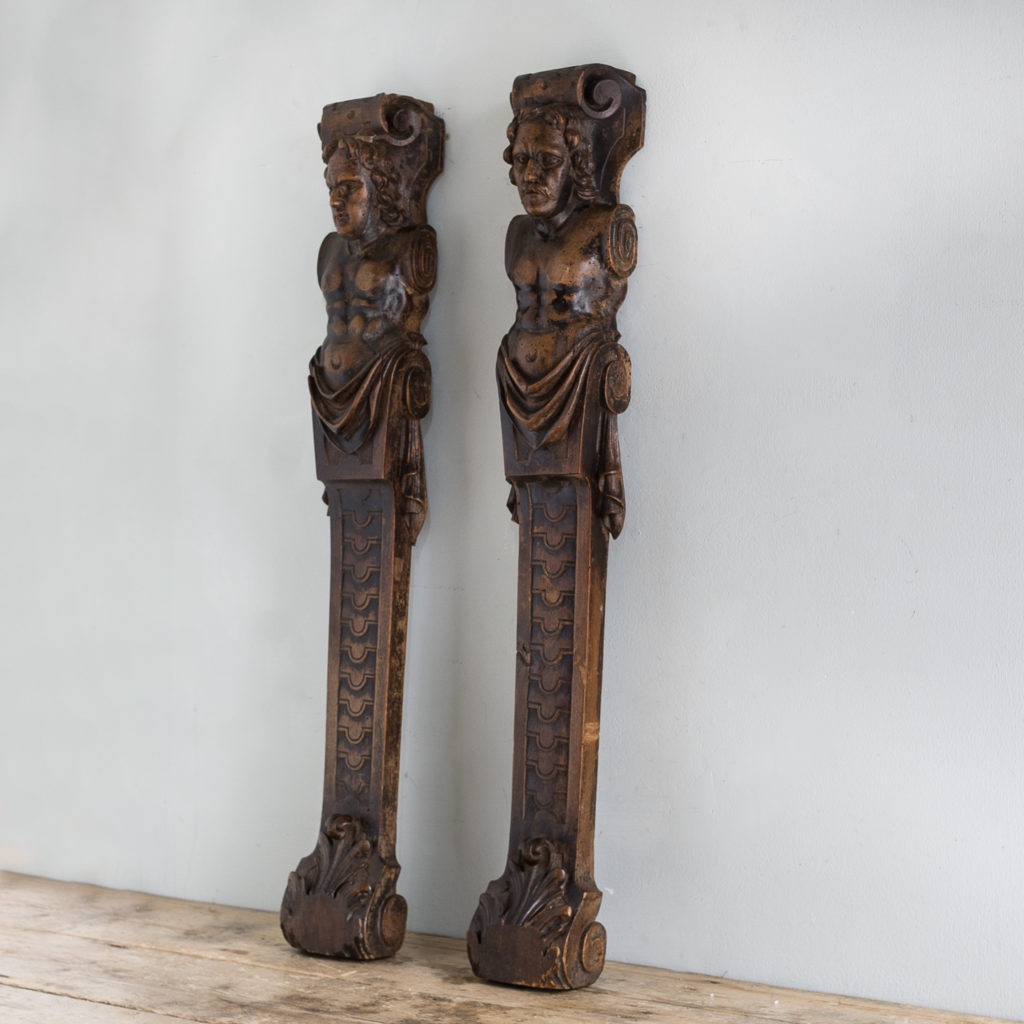 Pair of eighteenth century walnut figural terms,