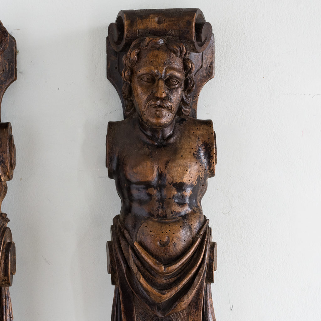 Pair of eighteenth century walnut figural terms,