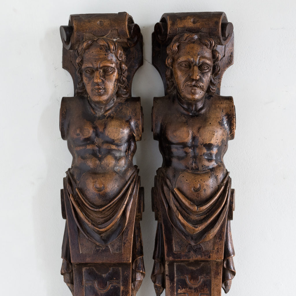 Pair of eighteenth century walnut figural terms,