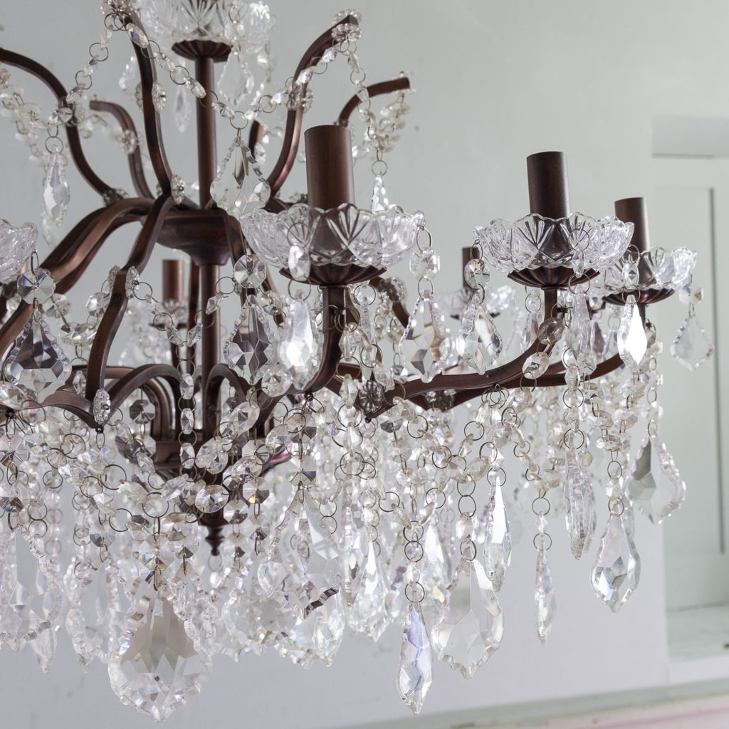 Twelve light glass lustre and bronzed metal chandeliers, -131596