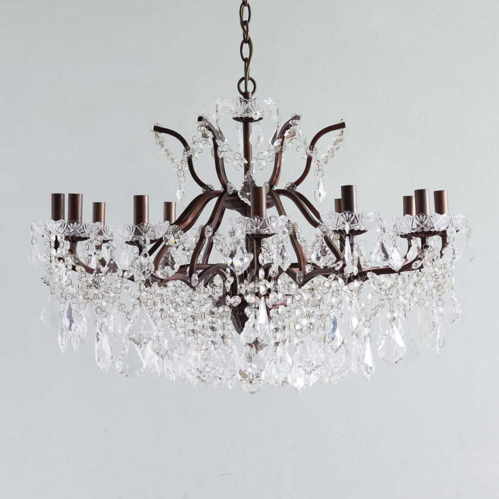 Twelve light glass lustre and bronzed metal chandeliers,