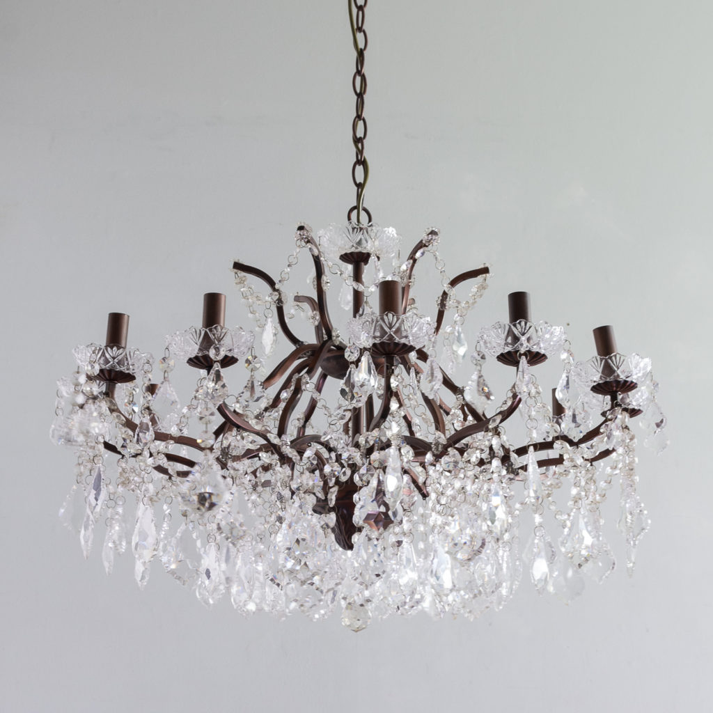 Twelve light glass lustre and bronzed metal chandeliers,