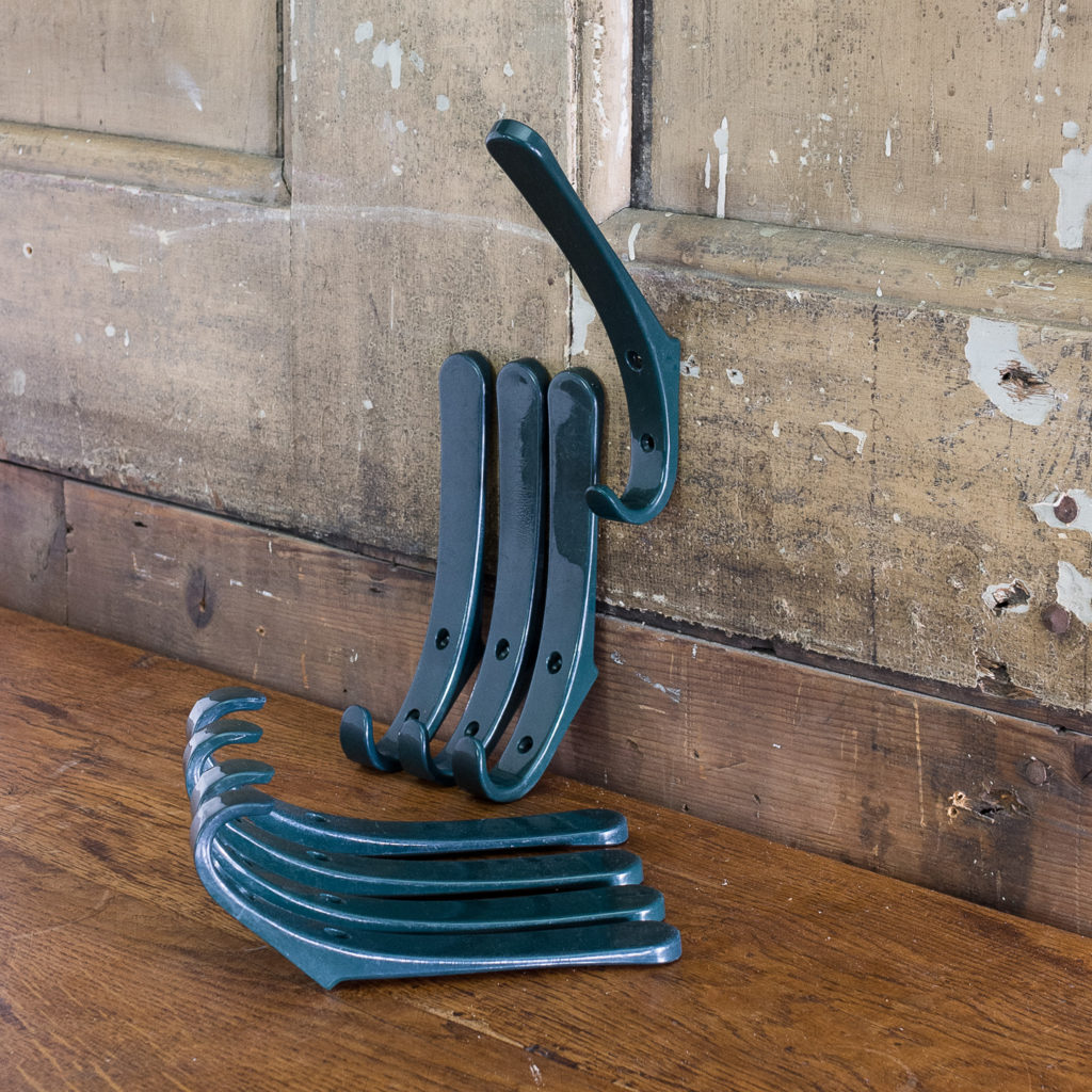 Green plastic school coat hooks