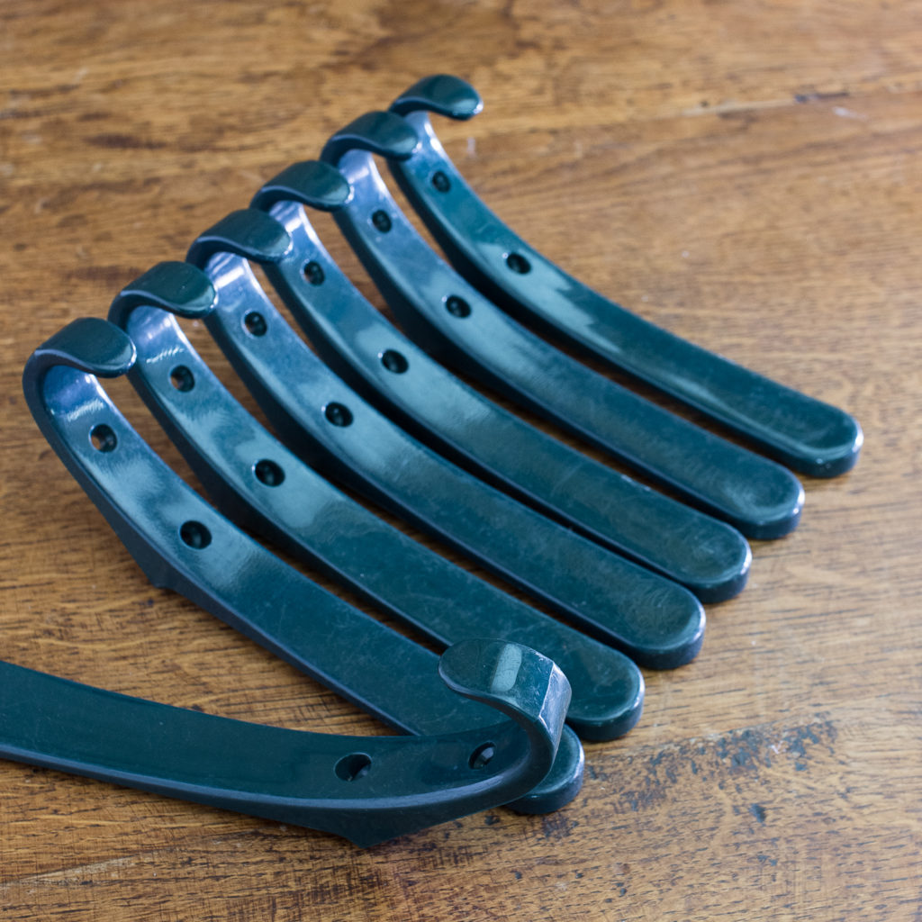 Green plastic school coat hooks