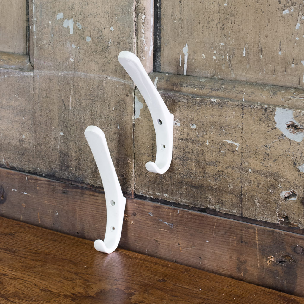 White plastic school coat hooks