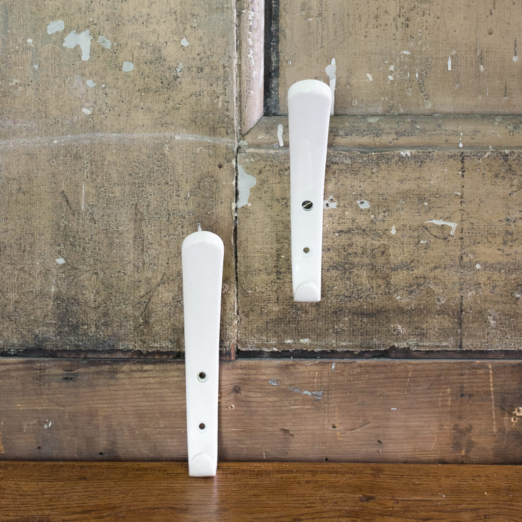 White plastic school coat hooks