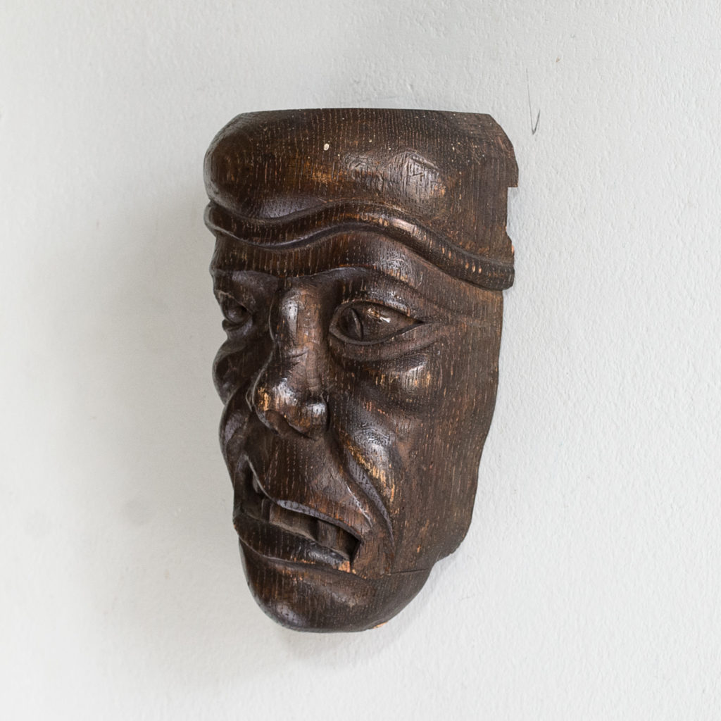 Early twentieth century carved oak grotesque mask,