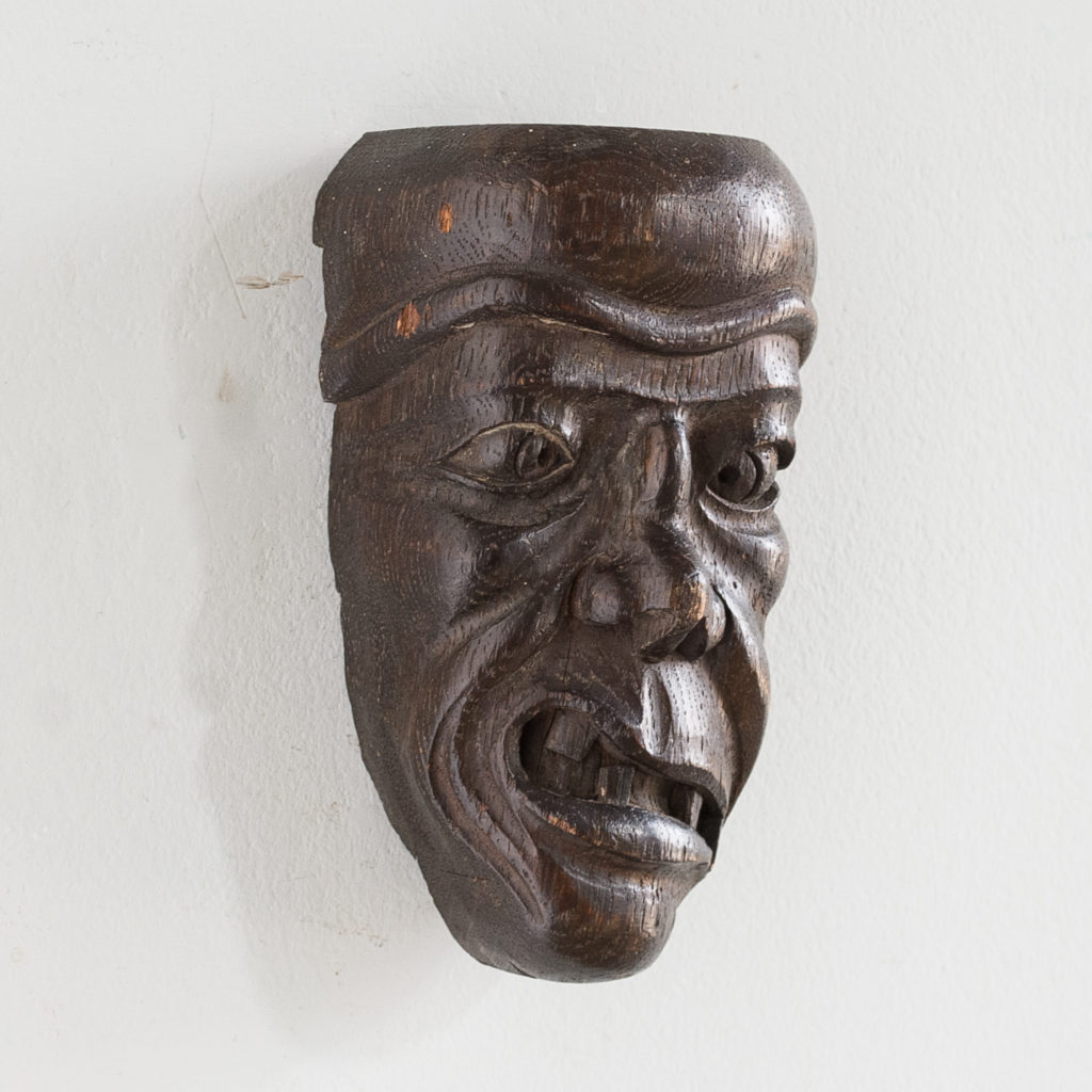 Early twentieth century carved oak grotesque mask,