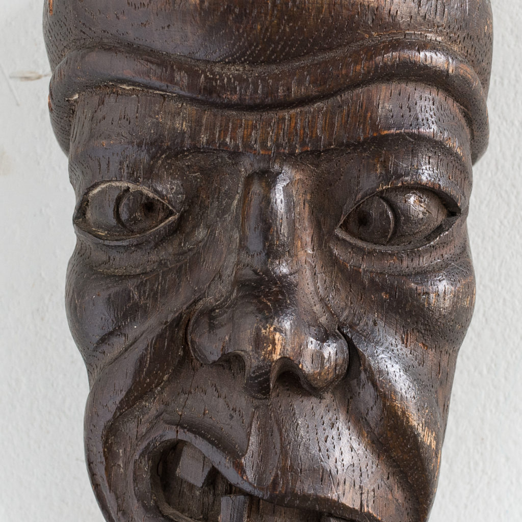 Early twentieth century carved oak grotesque mask,
