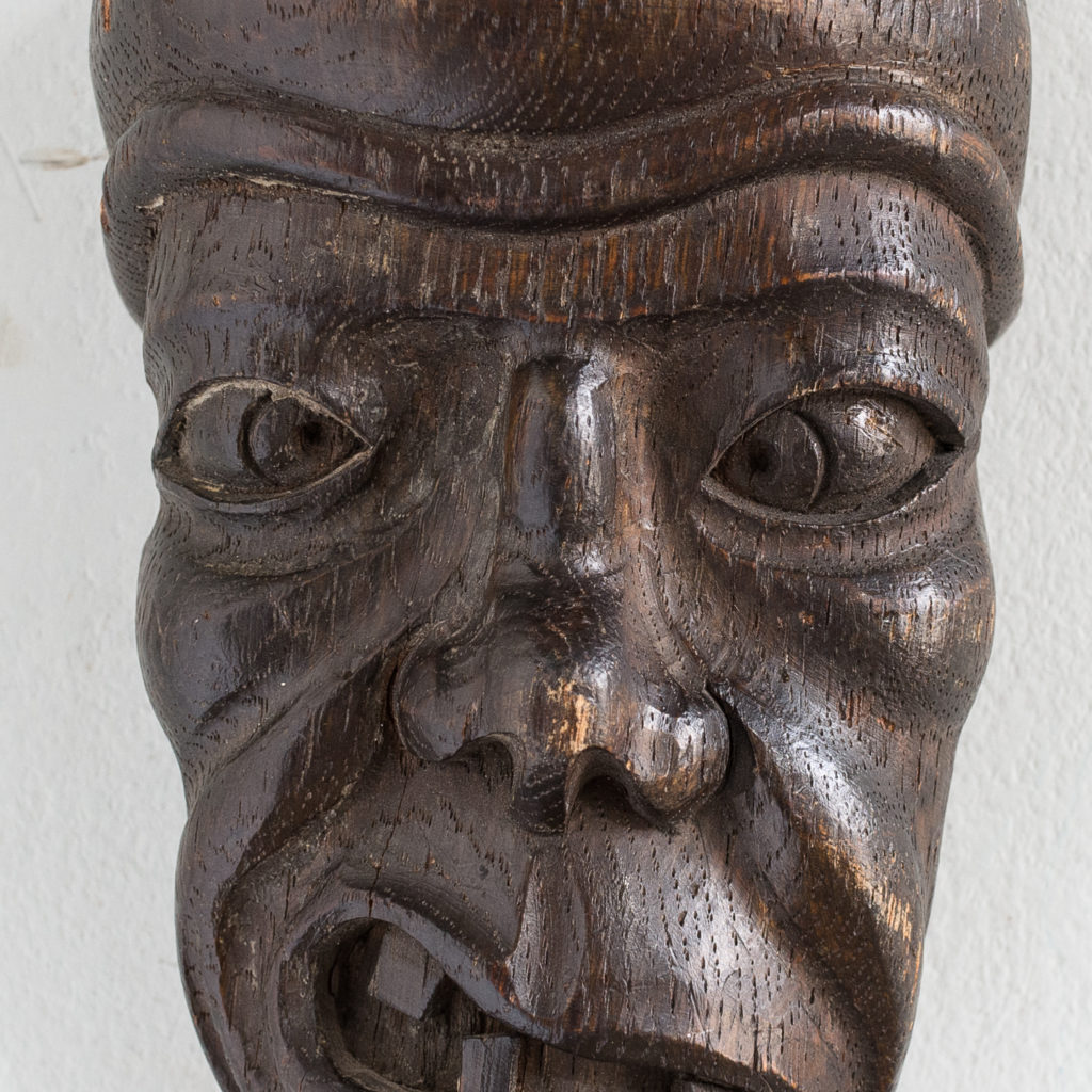 Early twentieth century carved oak grotesque mask,