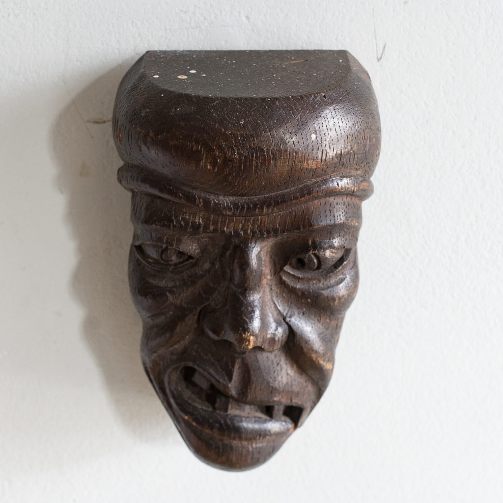 Early twentieth century carved oak grotesque mask,