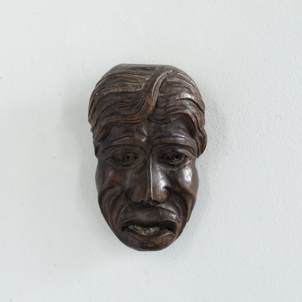 Early twentieth century carved oak grotesque mask,