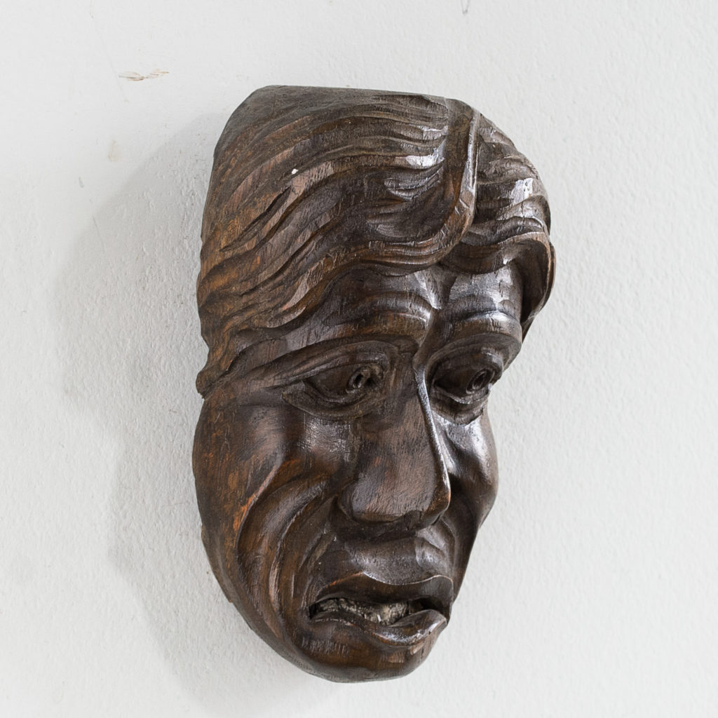 Early twentieth century carved oak grotesque mask,