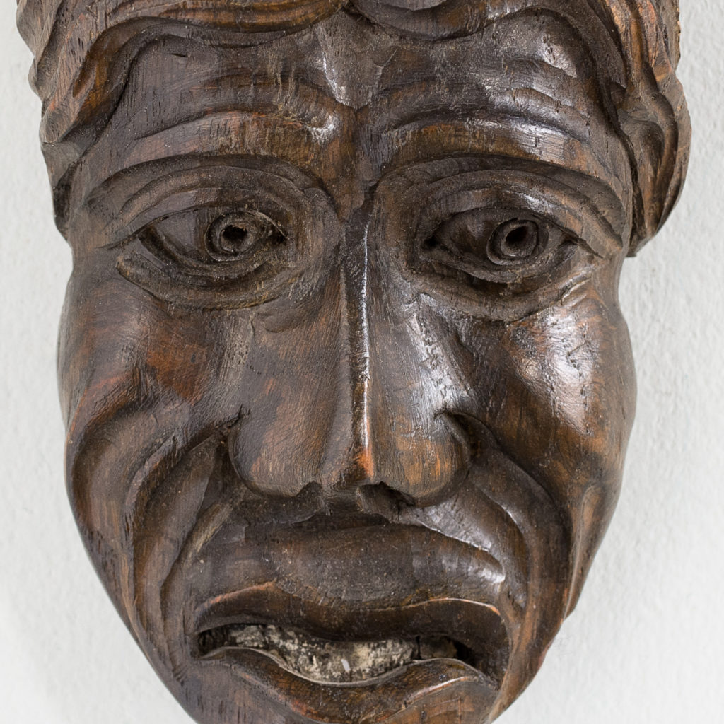 Early twentieth century carved oak grotesque mask,