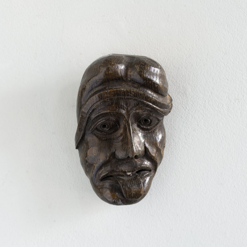 Early twentieth century carved oak grotesque mask,