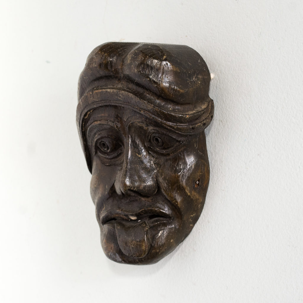 Early twentieth century carved oak grotesque mask,