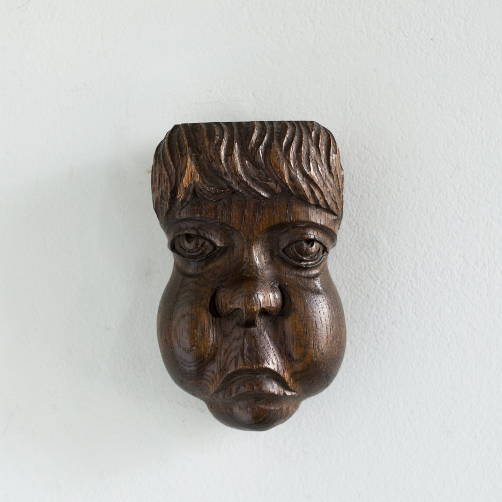 Early twentieth century carved oak grotesque mask,