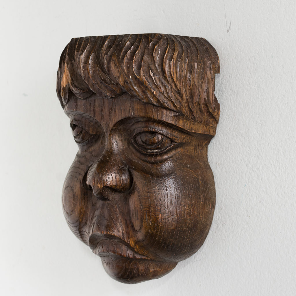 Early twentieth century carved oak grotesque mask,