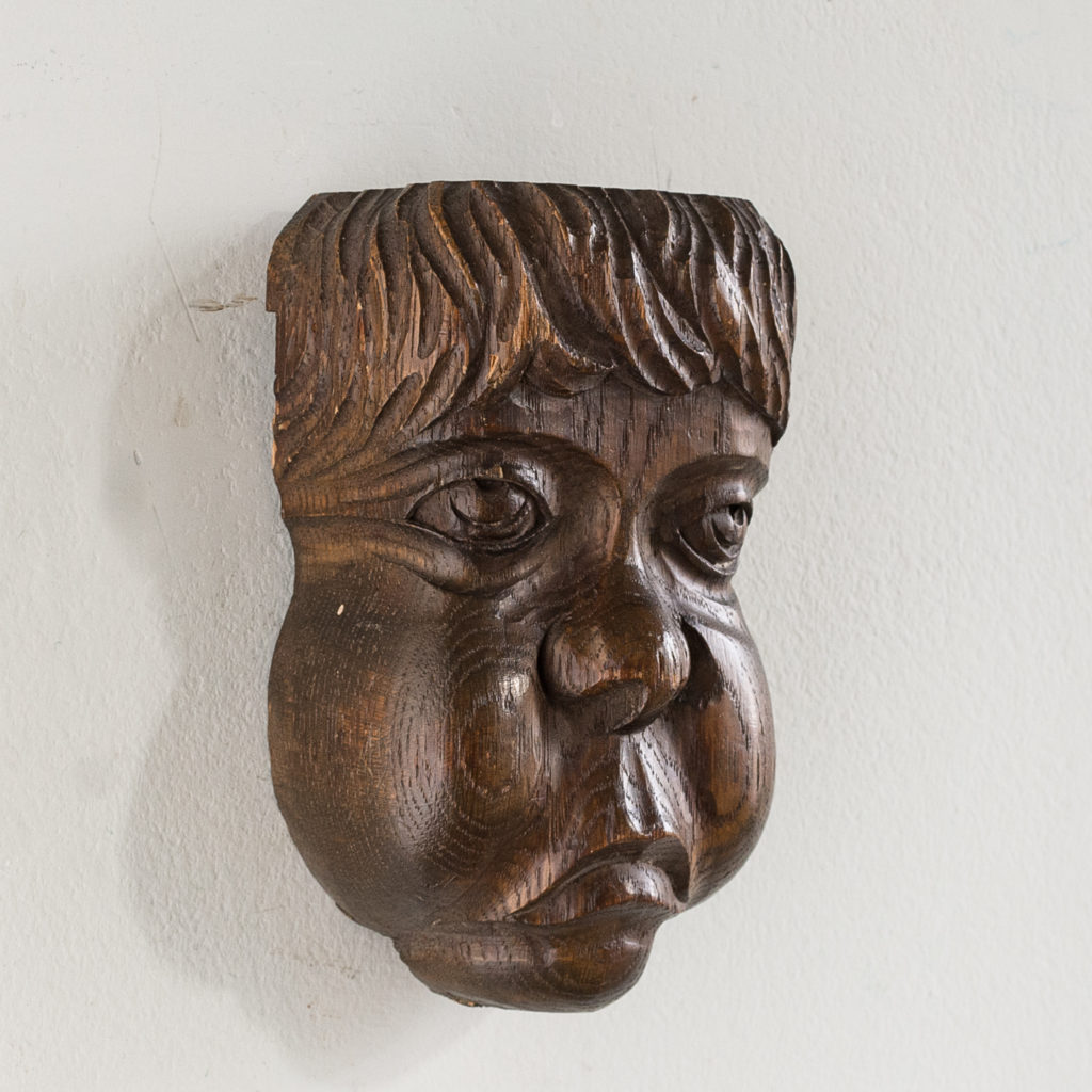 Early twentieth century carved oak grotesque mask,