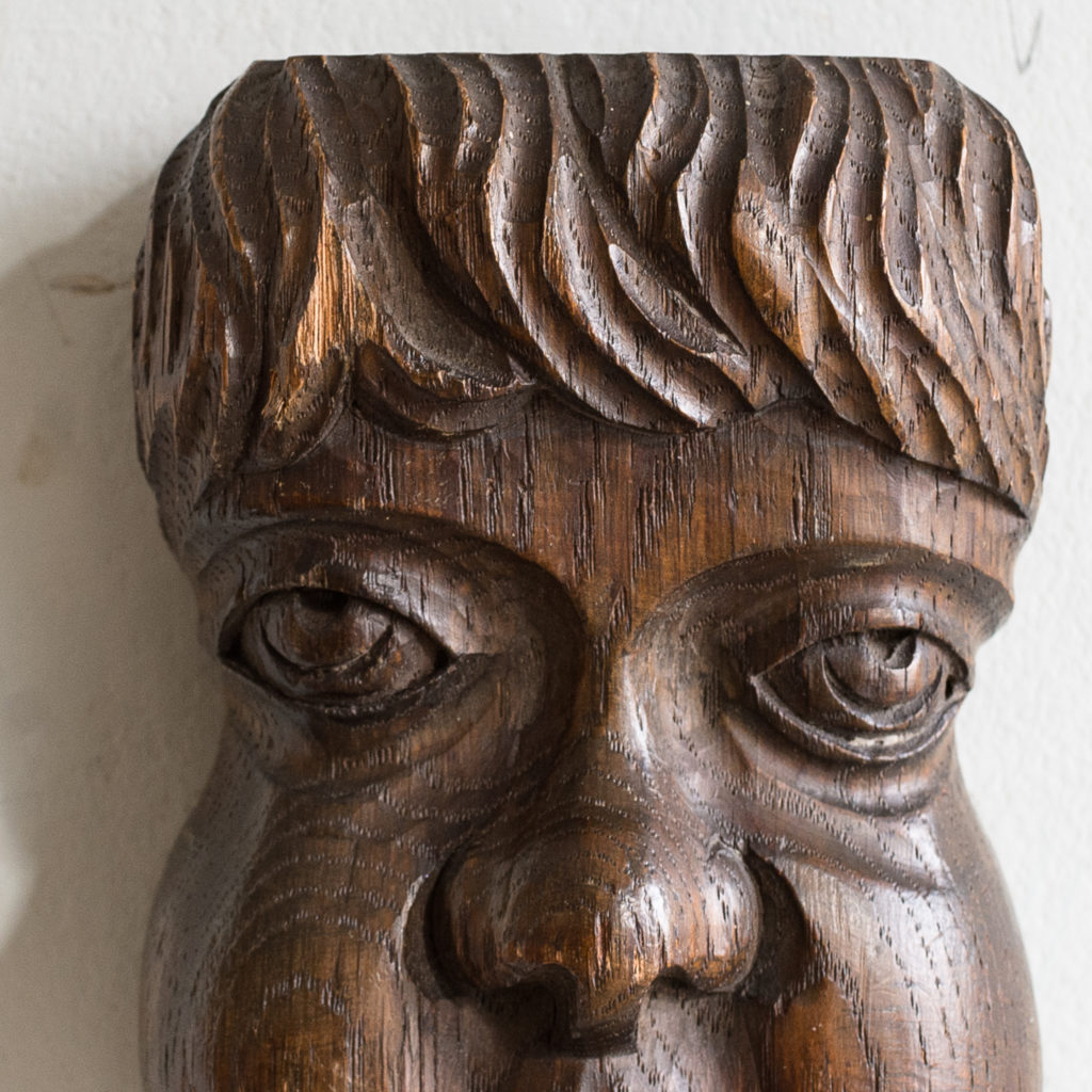 Early twentieth century carved oak grotesque mask,