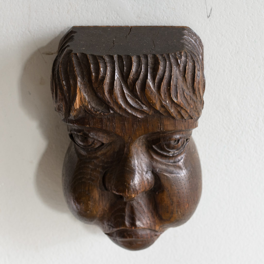 Early twentieth century carved oak grotesque mask,