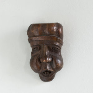 Early twentieth century carved oak grotesque mask,