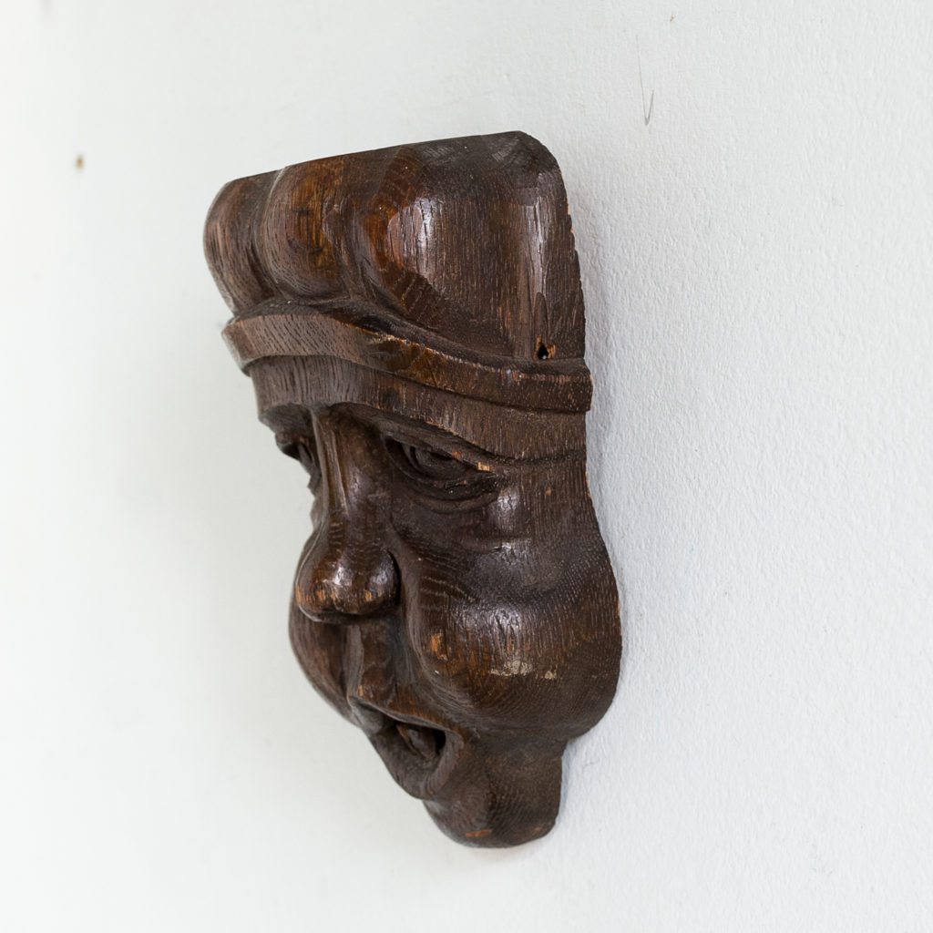 Early twentieth century carved oak grotesque mask,