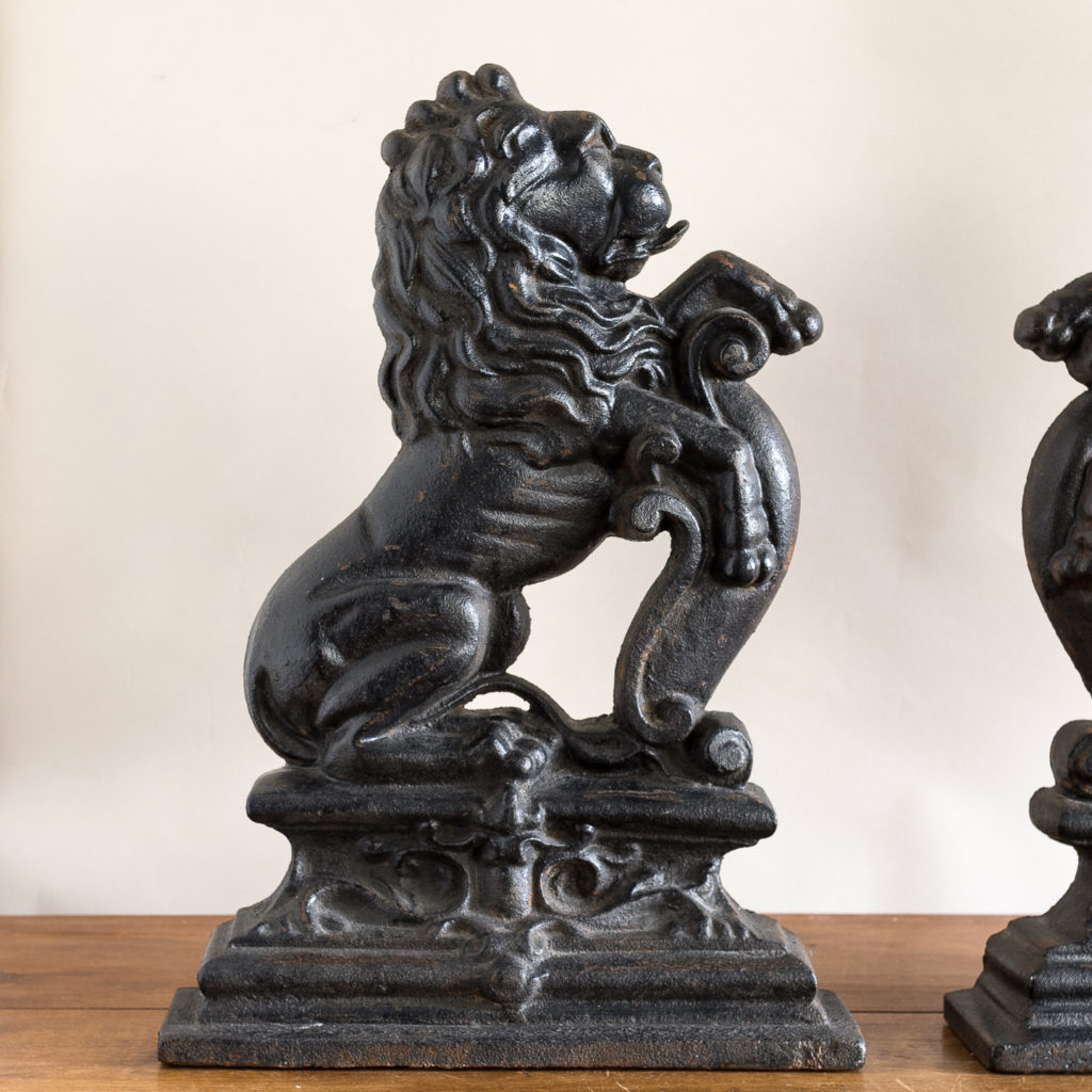 Pair of late Victorian rampant lion cast iron door stops,