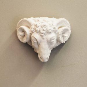 An English cast plaster head of a ram-0