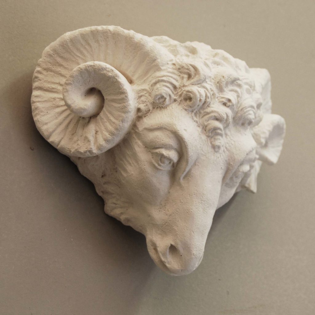 An English cast plaster head of a ram-135736