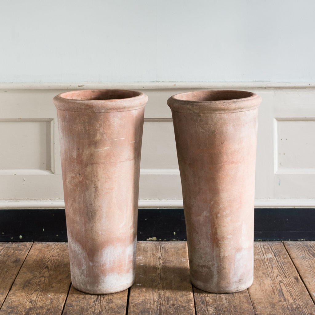 Tapered cylindrical terracotta planters,