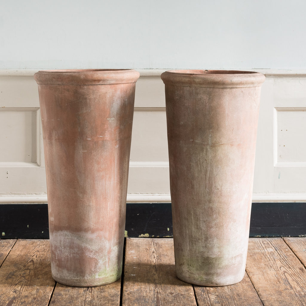 Tapered cylindrical terracotta planters,