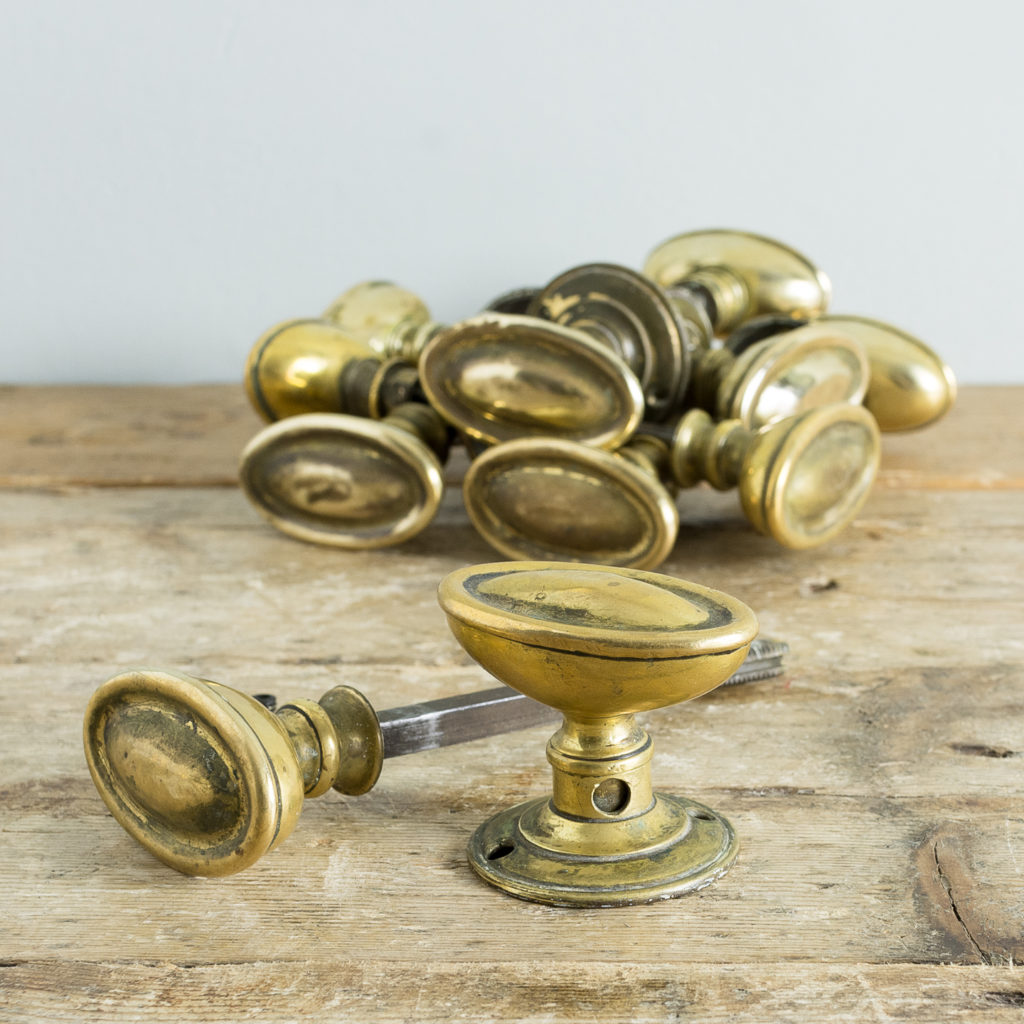 Edwardian pressed brass rim lock oval door knobs,