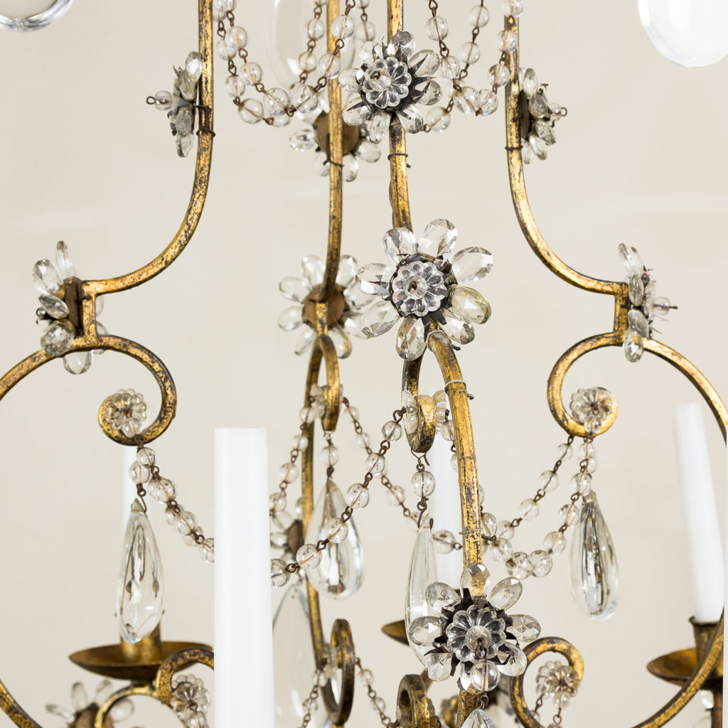 the frame hung with cascades of glass beads and pear shaped pendants