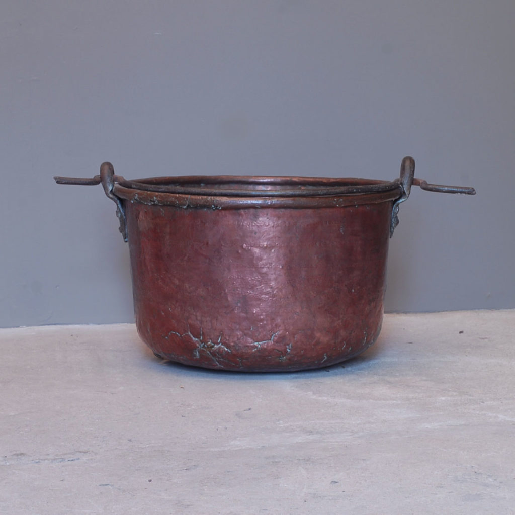 A planished copper and wrought iron cooking pot-137990