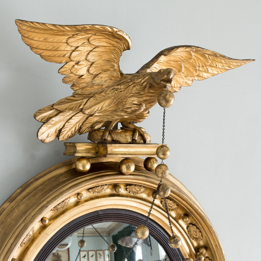 with bold carved eagle surmount,