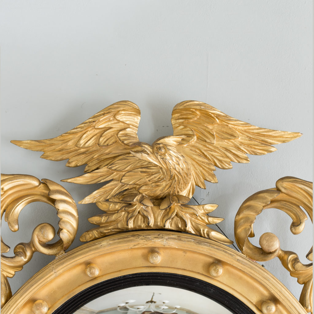 the eagle surmount flanked by scrolled acanthus