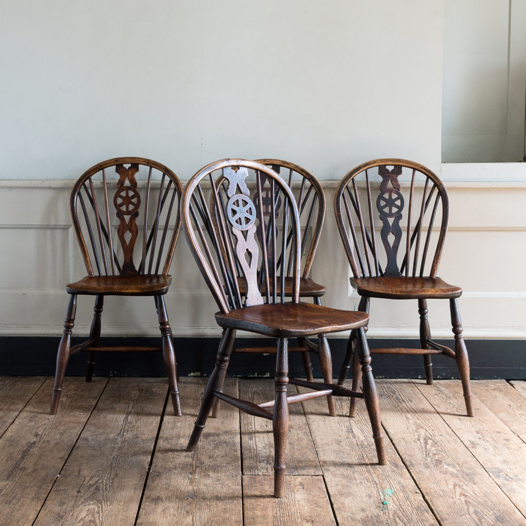 Set of four nineteenth century wheelback Windsor chairs,