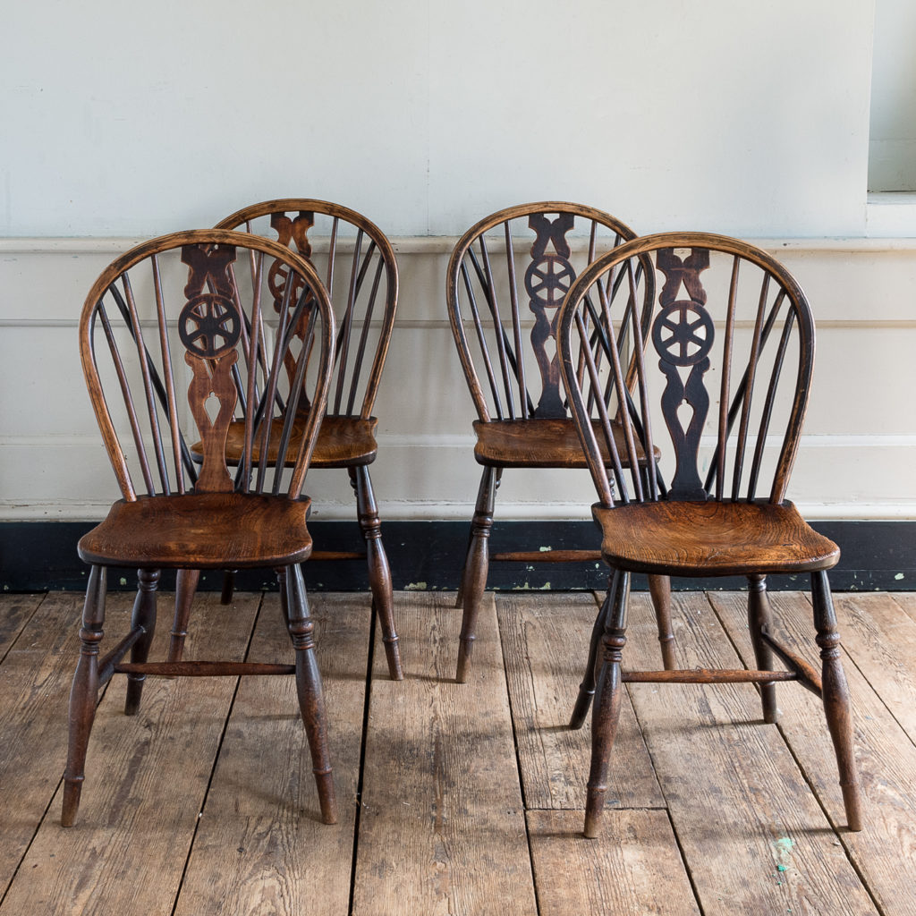 Set of four nineteenth century wheelback Windsor chairs,