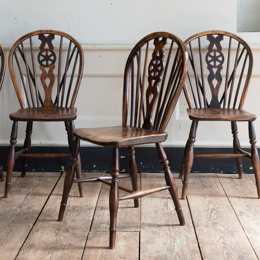 Set of four nineteenth century wheelback Windsor chairs,-137950