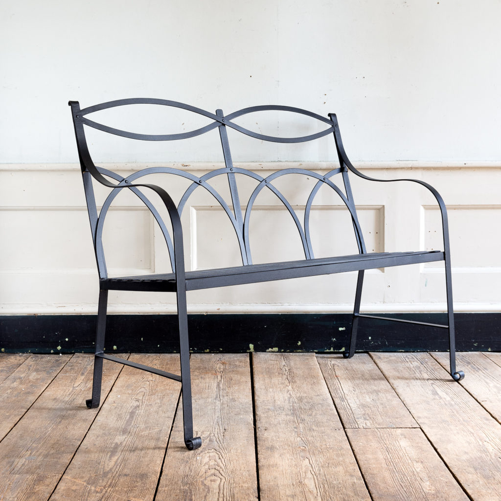 Regency style wrought iron garden bench,