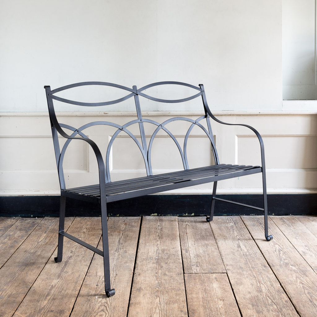 Regency style wrought iron garden bench,