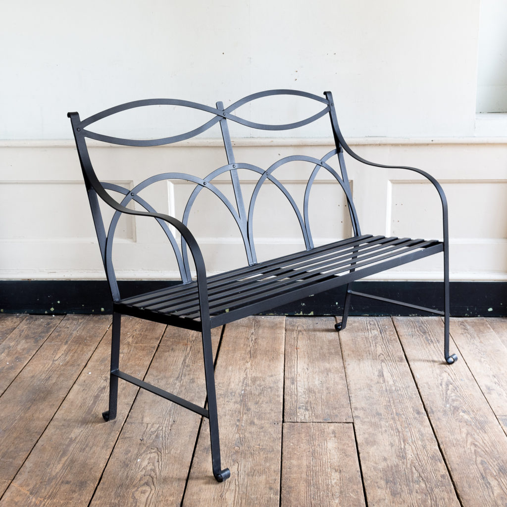 Regency style wrought iron garden bench,