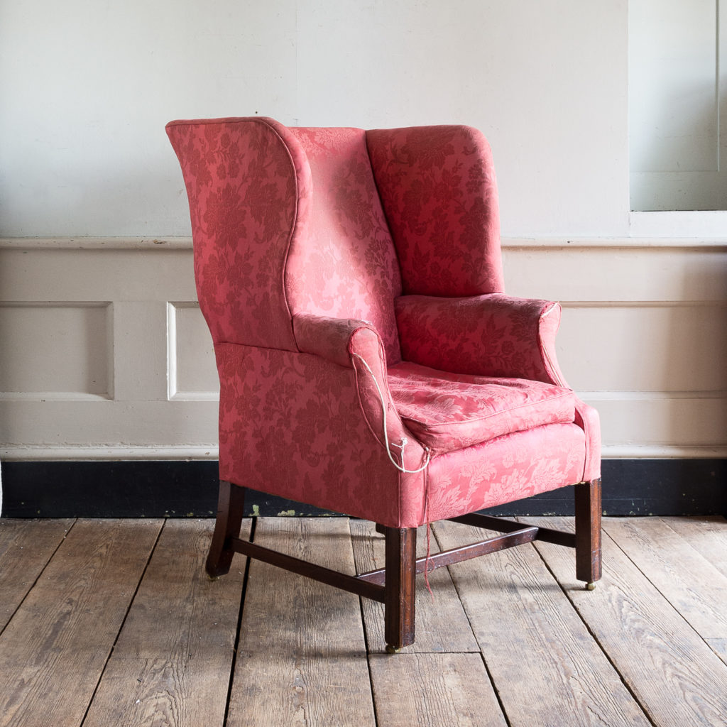 George III mahogany wingback armchair,