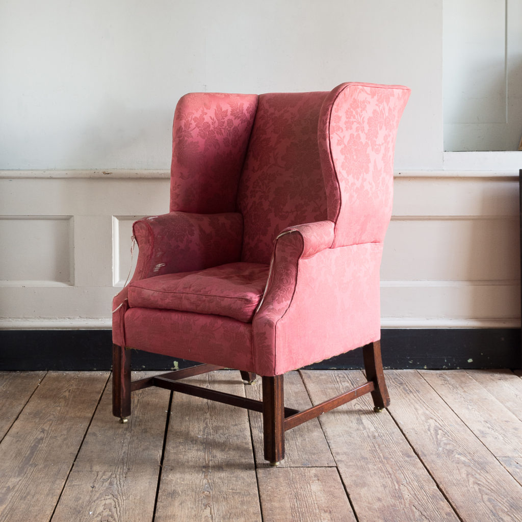 George III mahogany wingback armchair,