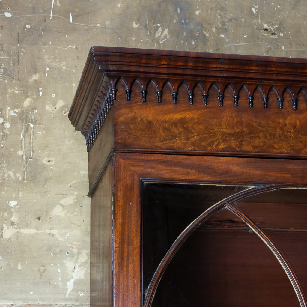 the moulded cornice above frieze hung with gothic pendants