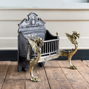 Victorian iron and brass Griffin fire grate,