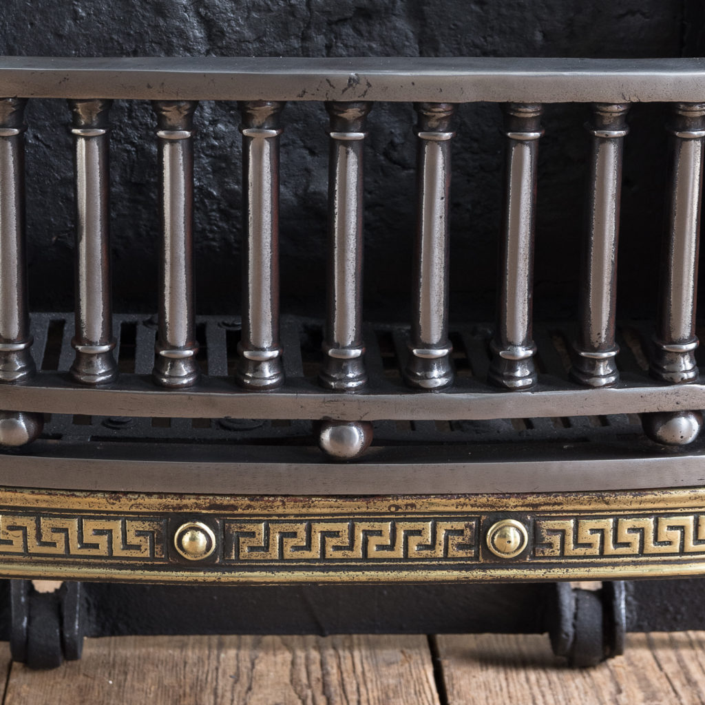 grate composed of a run of doric columns with a Greek key apron band below