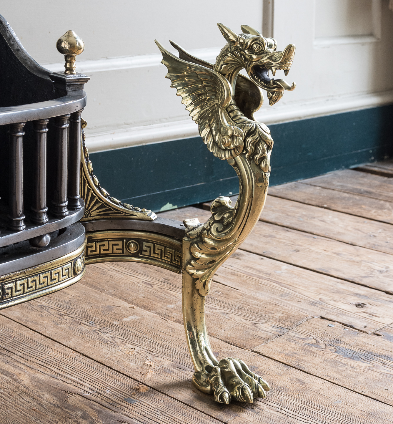 cast brass Griffin monopodia with hairy paw feet.
