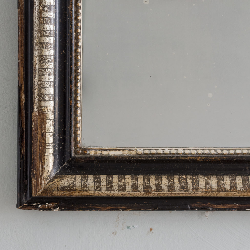 French ebonised and parcel silver-gilt wall mirror,-139999